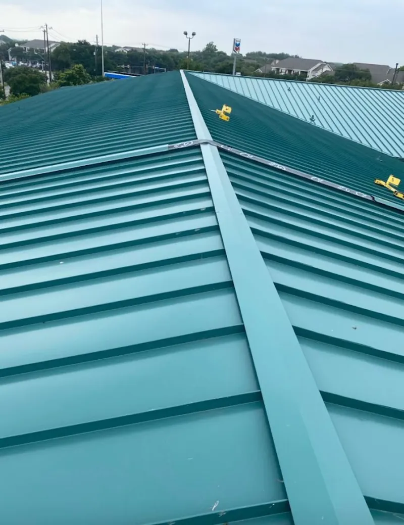 Green commercial metal roof ridge and valley for Metal Roof Repair in Waite Park