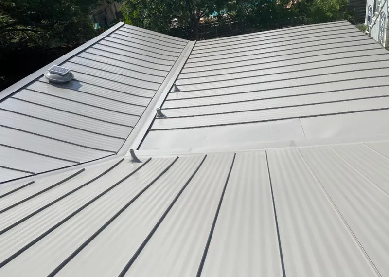 Solar attic fan installed on a metal roof for Roof Ventilation in Waite Park